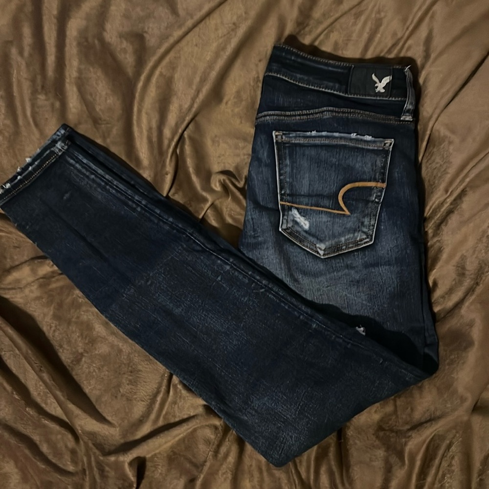 Size 4 American Eagle, super distressed, dark wash skinnies